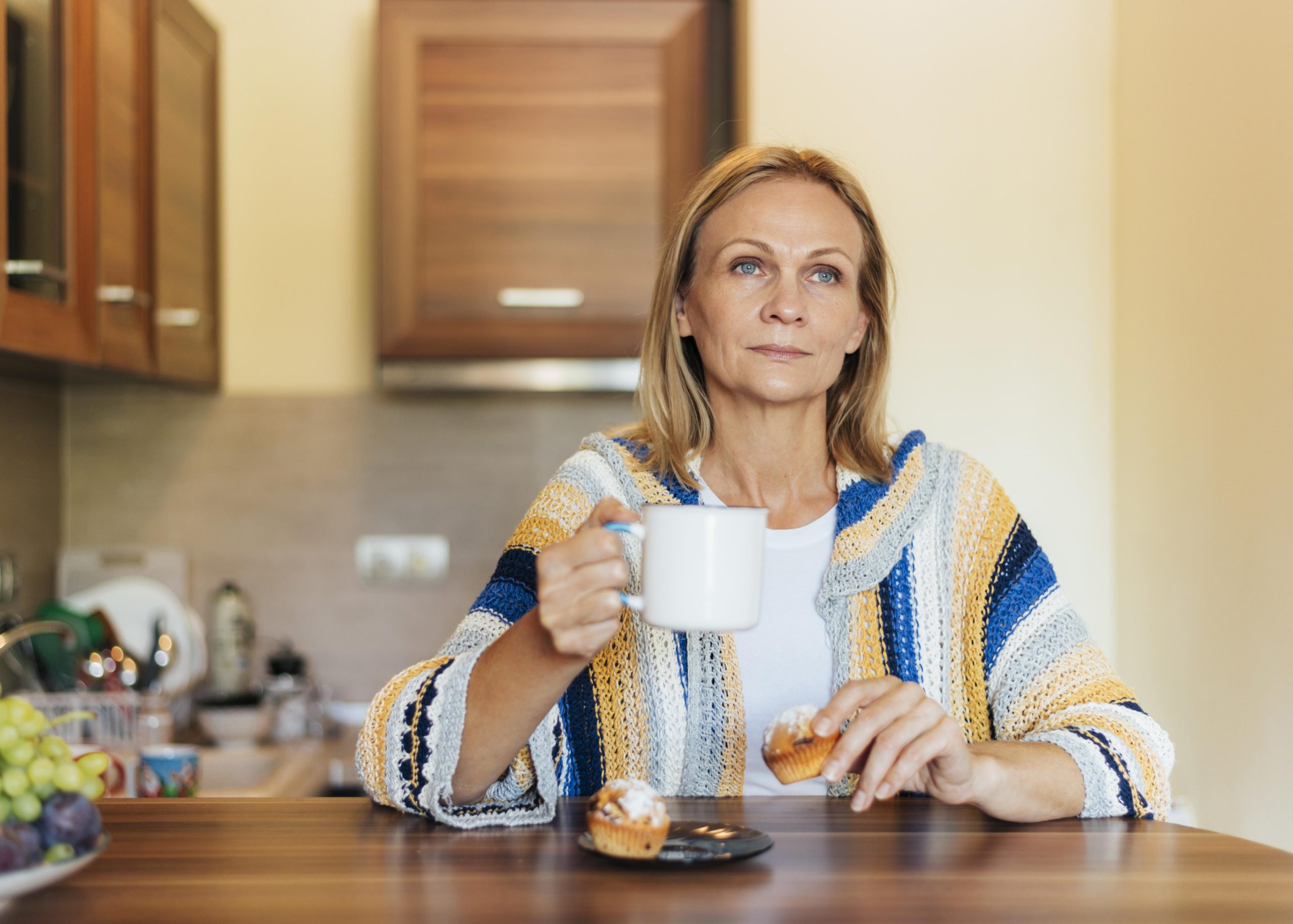 Midlife woman sitting quietly with a cup of tea Midlife woman sitting quietly with a cup of tea