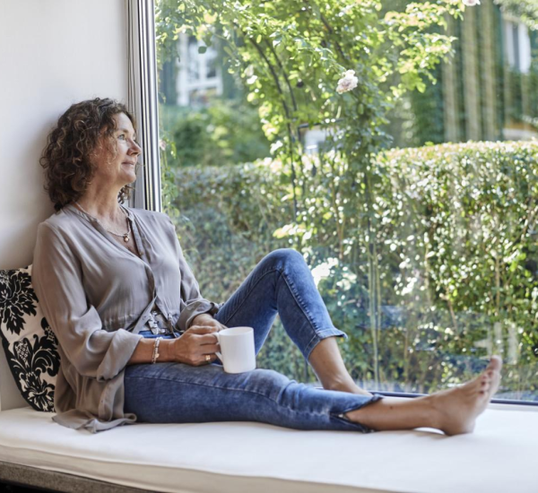 A contemplative woman, deeply engaged in her thoughts and reflections